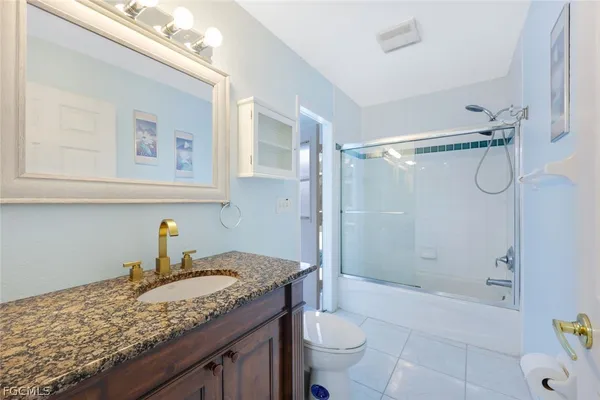 a view of a swimming pool with a table and chairs