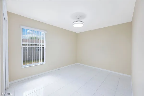 a view of a backyard with swimming pool