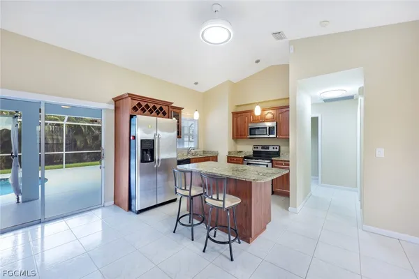 a view of kitchen with cabinets and outdoor view
