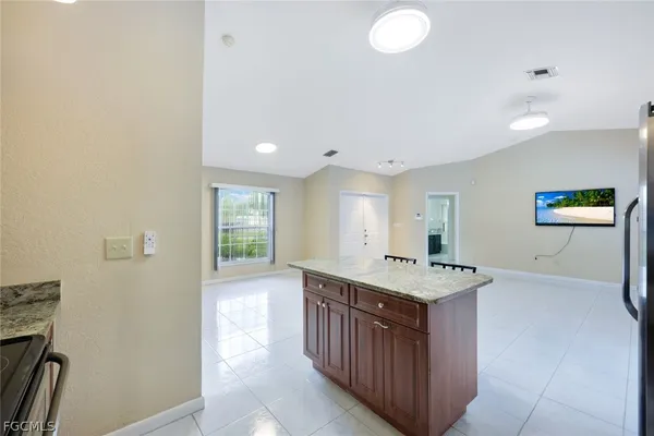 a kitchen with a stove and a sink