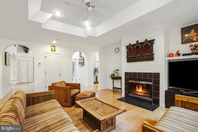 a dining room with furniture and wooden floor