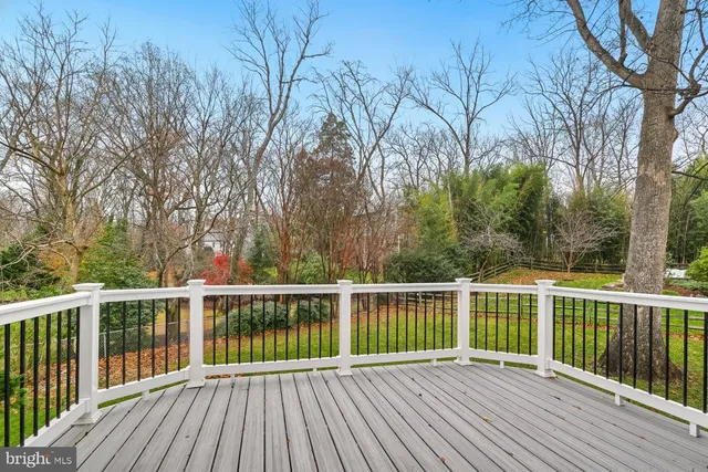 a kitchen with stainless steel appliances granite countertop a sink and a refrigerator
