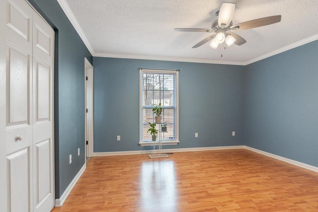 1409 Poplar Ridge Road Fuquay-Varina, NC 27526 - Photo 8 of 17 Primary Bedroom with plenty of sunlight