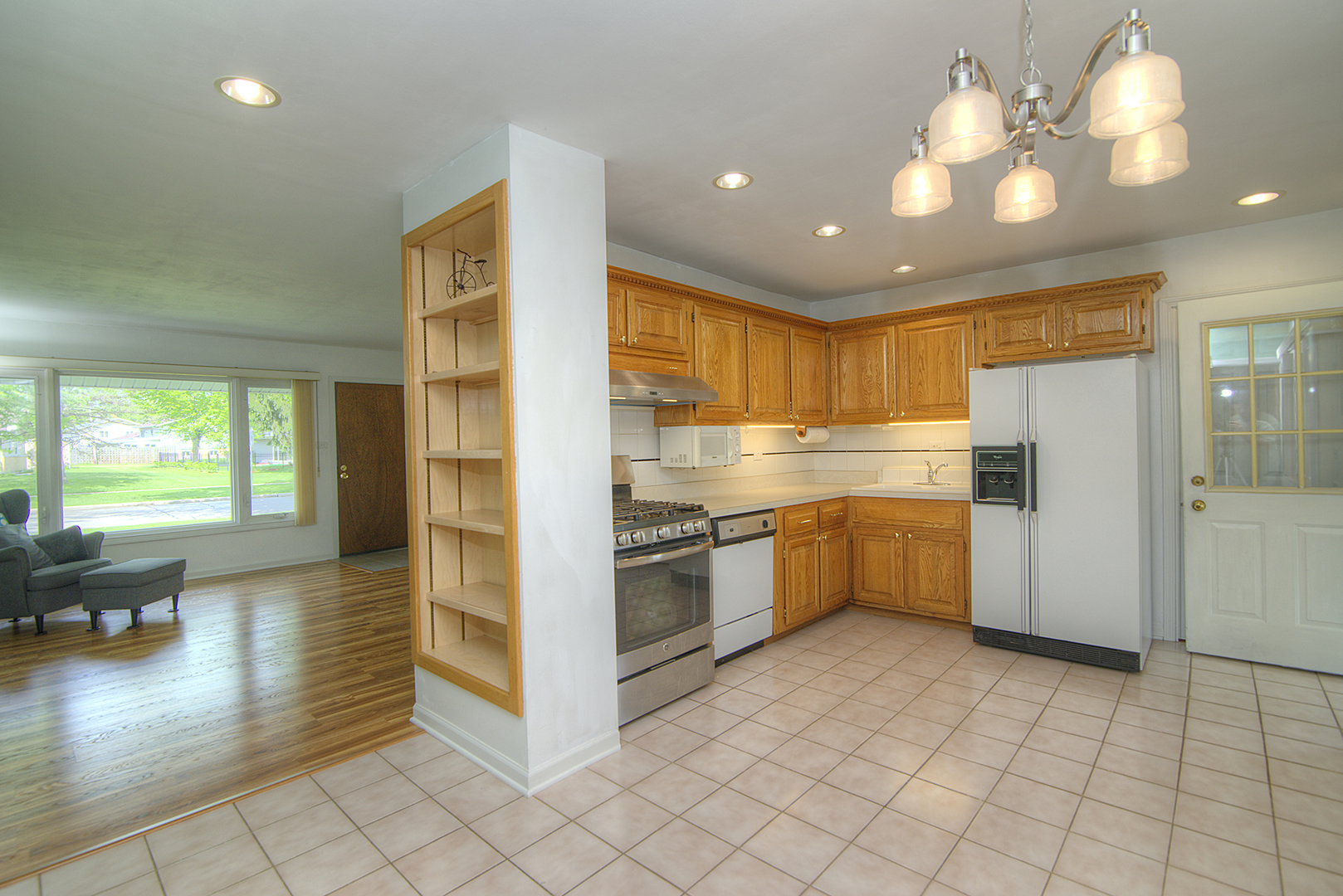 725 Washington Boulevard Hoffman Estates, IL 60169 - Photo 6 of 32 a kitchen with stainless steel appliances granite countertop a refrigerator and a sink