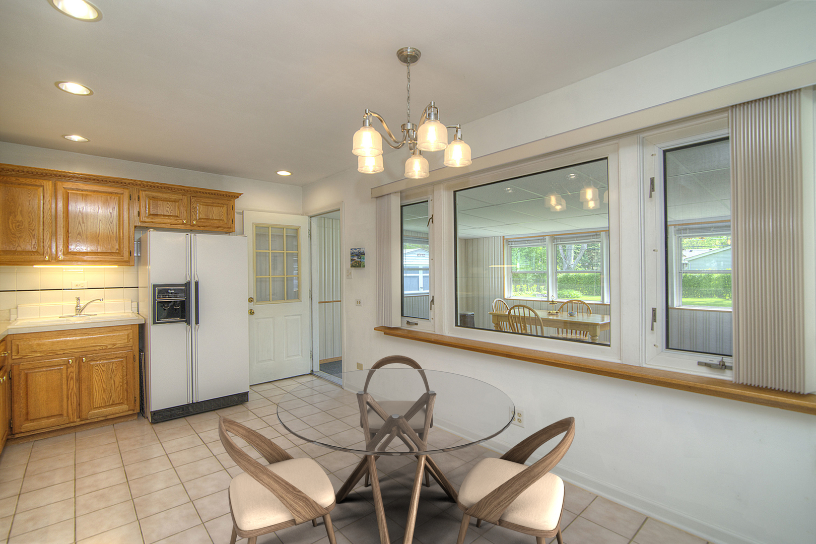725 Washington Boulevard Hoffman Estates, IL 60169 - Photo 7 of 32 a kitchen with sink and refrigerator
