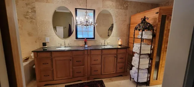 a bathroom with a double vanity sink and mirror