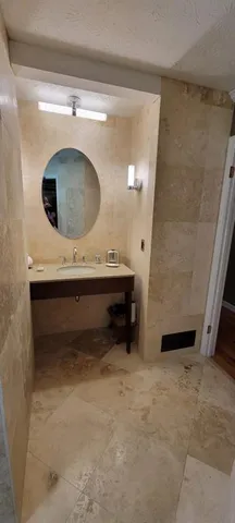a bathroom with a sink and a mirror
