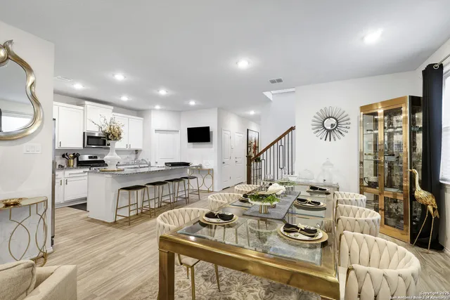 a open kitchen with stainless steel appliances kitchen island granite countertop a stove refrigerator and cabinets