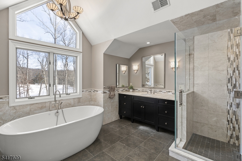 2 Cobblefield Road Mendham, NJ 07945 - Photo 28 of 50 a spacious bathroom with a tub sink shower and mirror