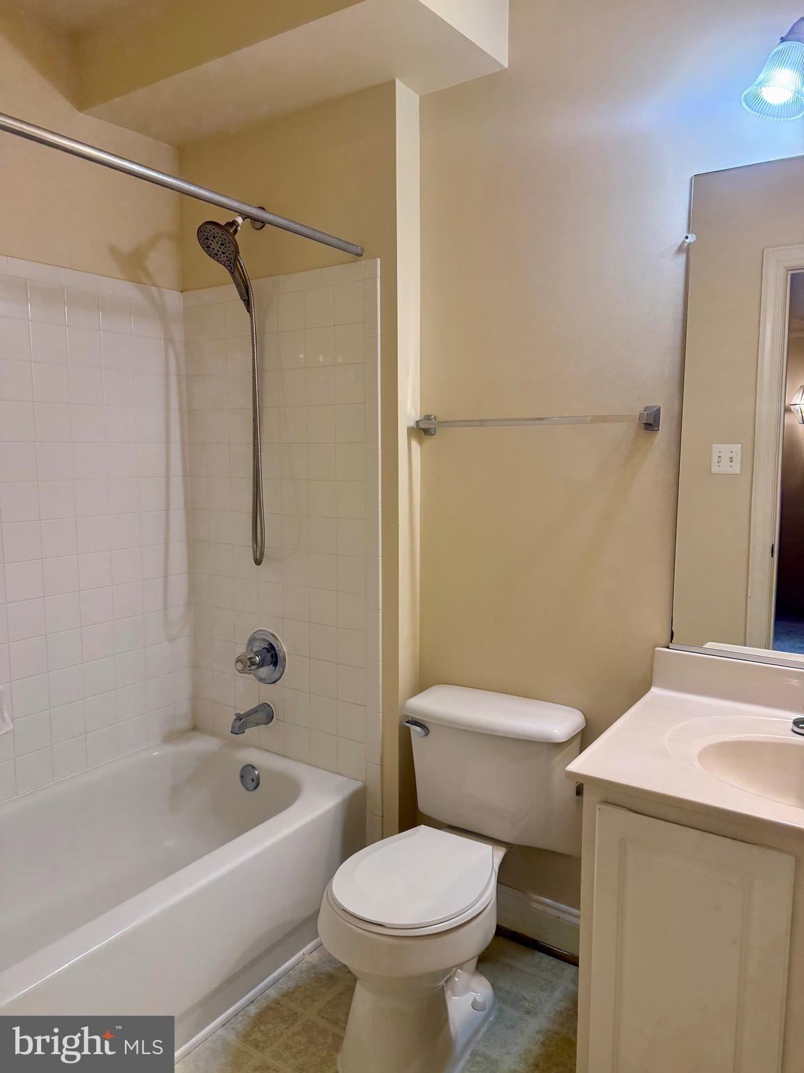 680 Orchard Ridge Drive, Unit 100 Gaithersburg, MD 20878 - Photo 22 of 25 a bathroom with a sink a toilet and a bathtub