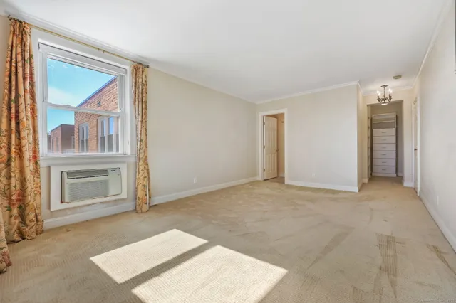 a view of an empty room with a window