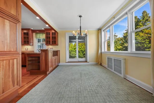a view of a dining room with furniture window and outside view