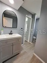 a bathroom with a sink and a mirror