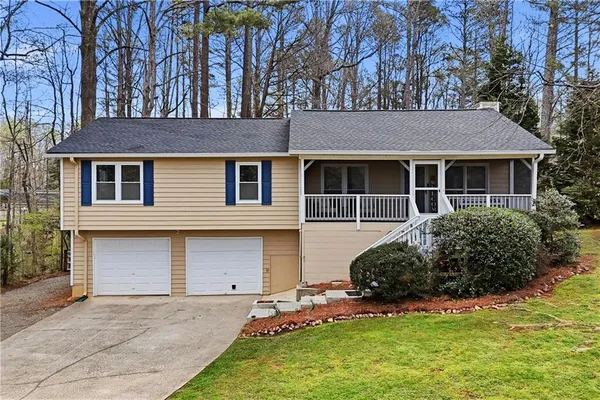 a view of house with yard