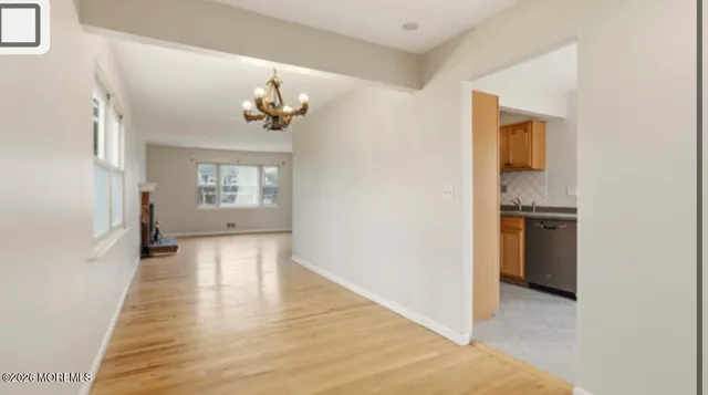 a view of a kitchen cabinets and wooden floor