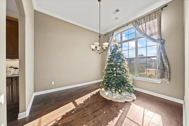 a very nice looking room with a large window and chandelier