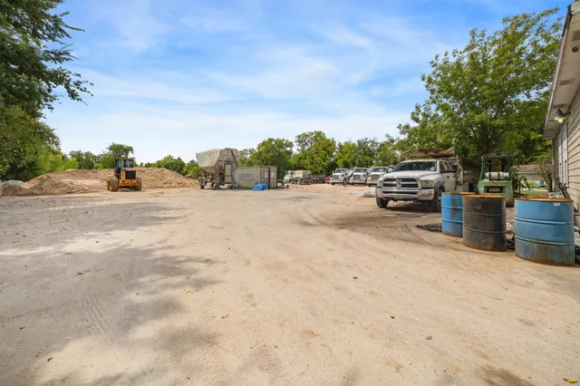 a view of road with large trees