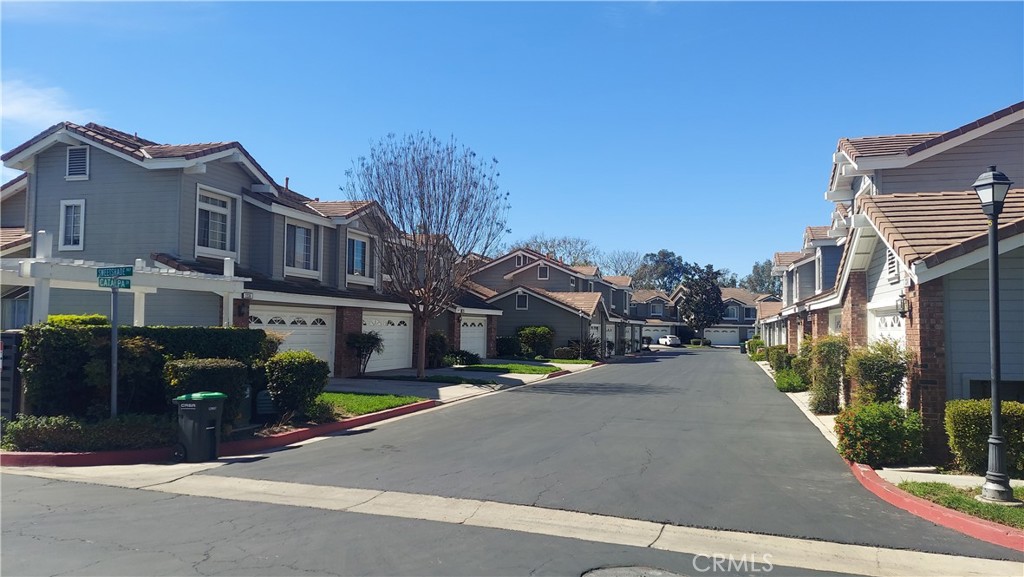 13582 Sweetshade Way Tustin, CA 92782 - Photo 2 of 12 a view of a street with houses