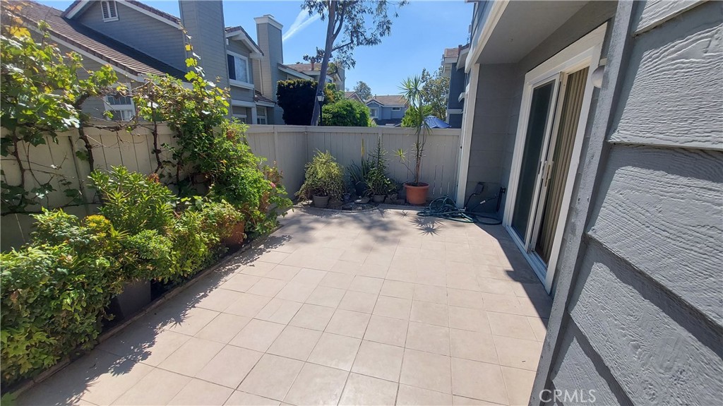 13582 Sweetshade Way Tustin, CA 92782 - Photo 8 of 12 a view of backyard with plants and outdoor seating