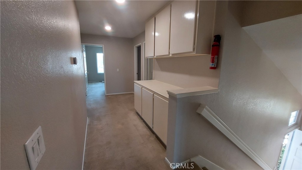13582 Sweetshade Way Tustin, CA 92782 - Photo 9 of 12 a bathroom with a sink a toilet and mirror