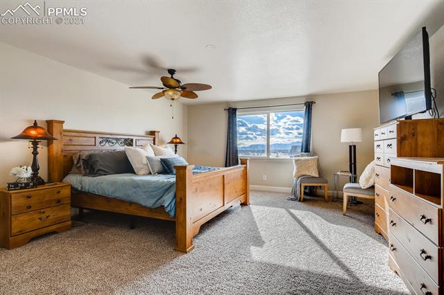 8380 Del Rio Road Peyton, CO 80831 - Photo 16 of 25 Master suite is a true retreat! Large windows inviting in plenty of natural light and has 5-piece master bath and spacious closets.