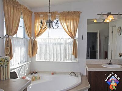 7916 Gaskell Road Rosamond, CA 93560 - Photo 5 of 5 a bathroom with a sink and a mirror
