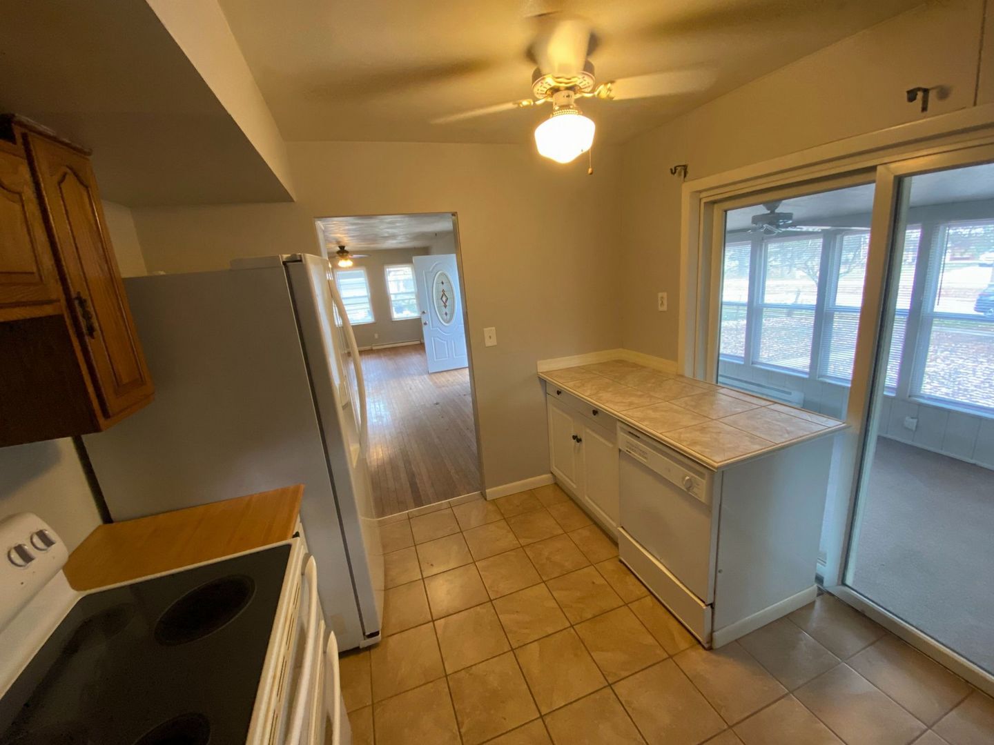 1011 Franklin Avenue Normal, IL 61761 - Photo 11 of 15 a view of a kitchen with fridge and wooden floor