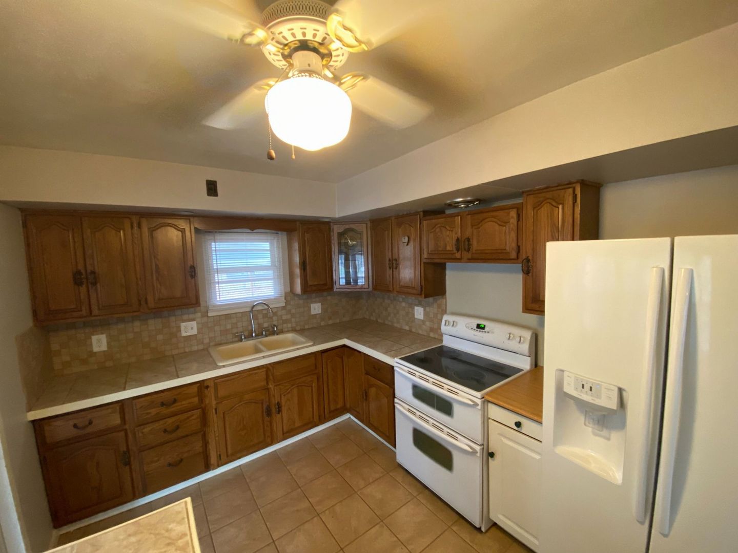 1011 Franklin Avenue Normal, IL 61761 - Photo 12 of 15 a kitchen with granite countertop stainless steel appliances a sink and cabinets