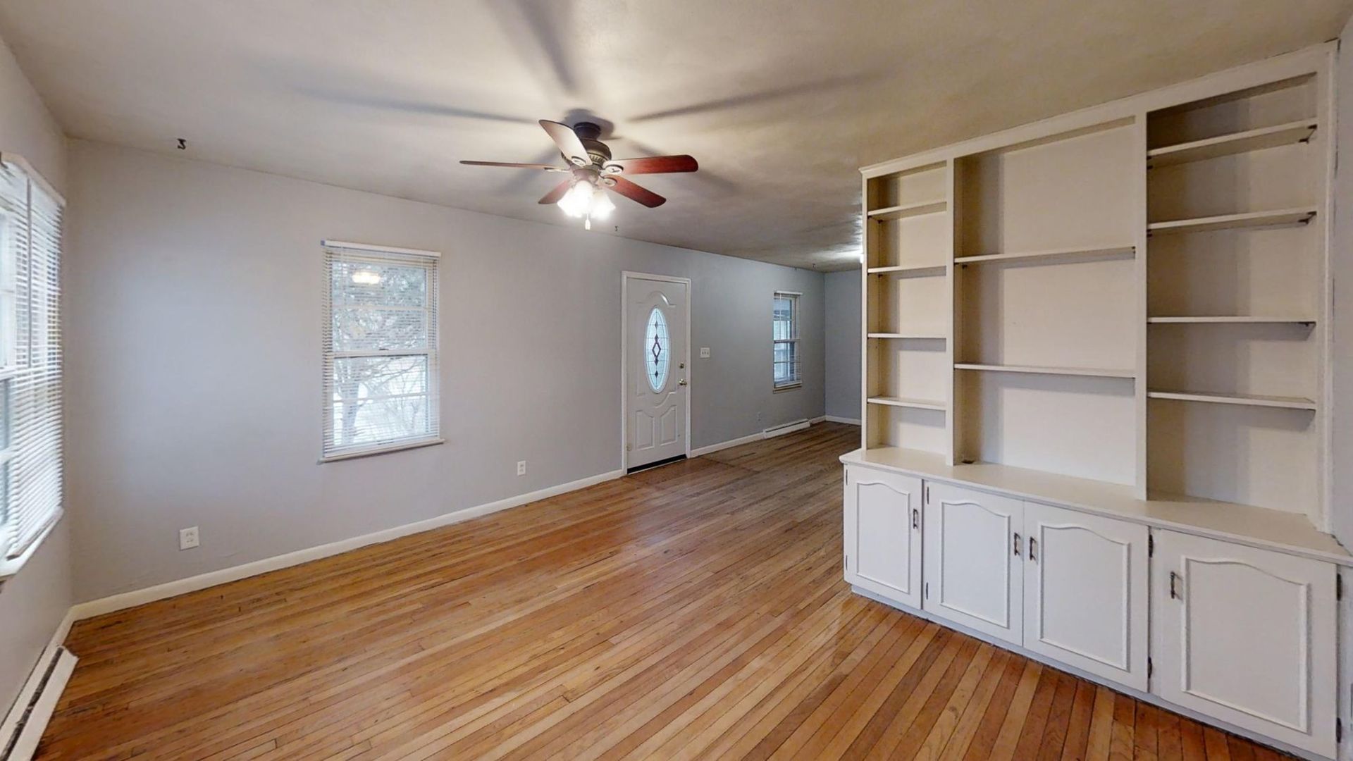 1011 Franklin Avenue Normal, IL 61761 - Photo 13 of 15 a view of an empty room with a window and wooden floor