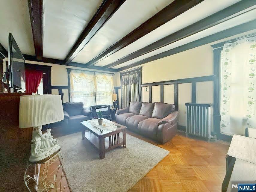 102 State Street Bloomfield, NJ 07003 - Photo 3 of 11 a living room with furniture and a large window