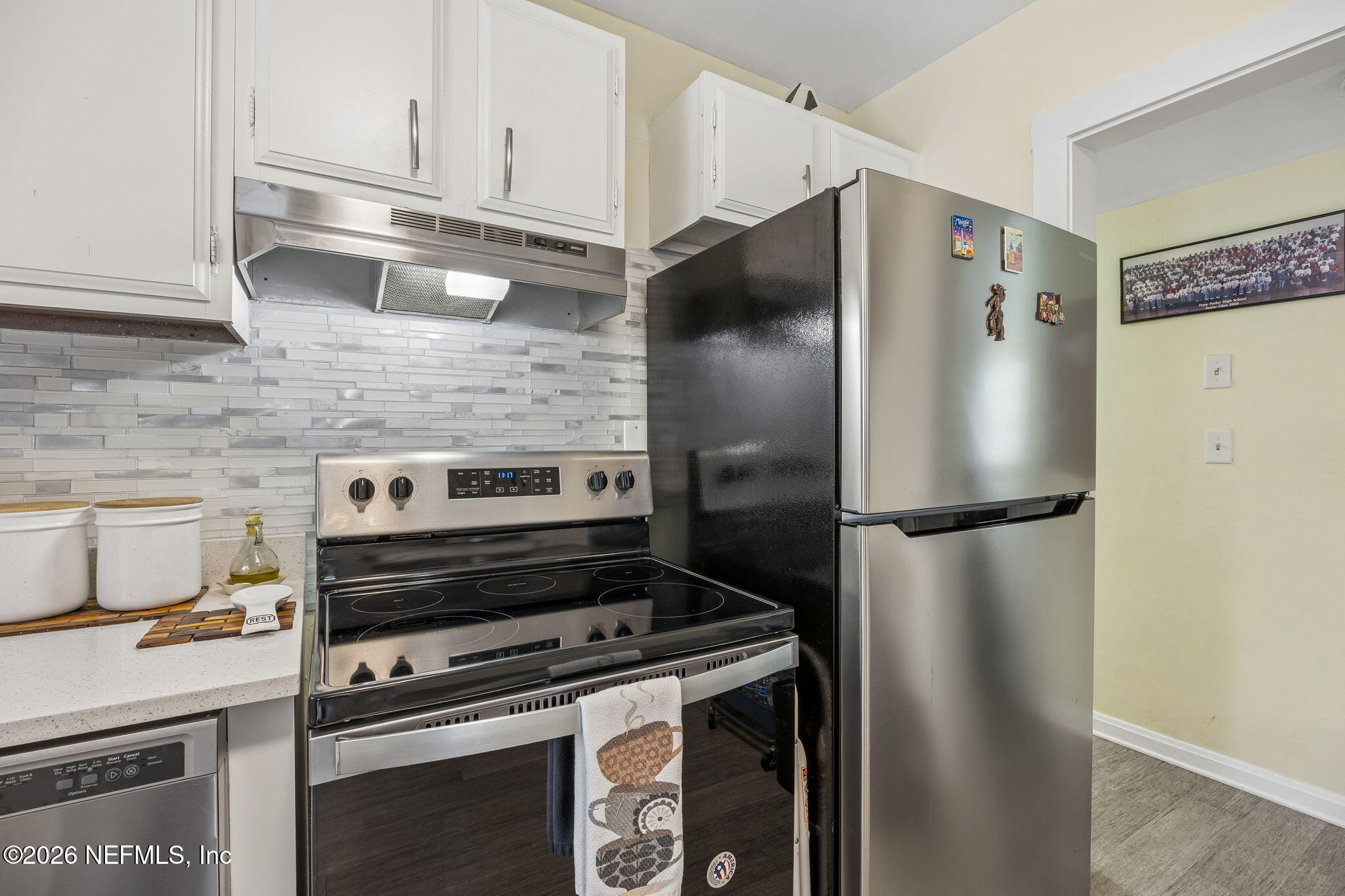 7022 Gaillardia Road South Jacksonville, FL 32211 - Photo 13 of 32 a metallic refrigerator freezer sitting in a kitchen