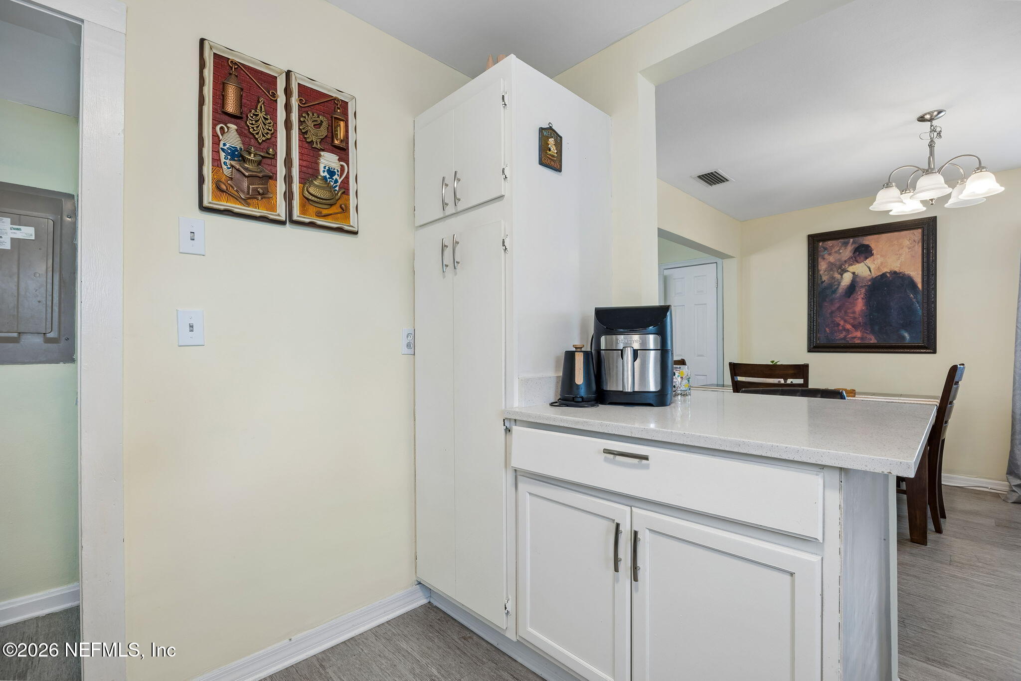 7022 Gaillardia Road South Jacksonville, FL 32211 - Photo 15 of 32 a kitchen with cabinets and black appliances