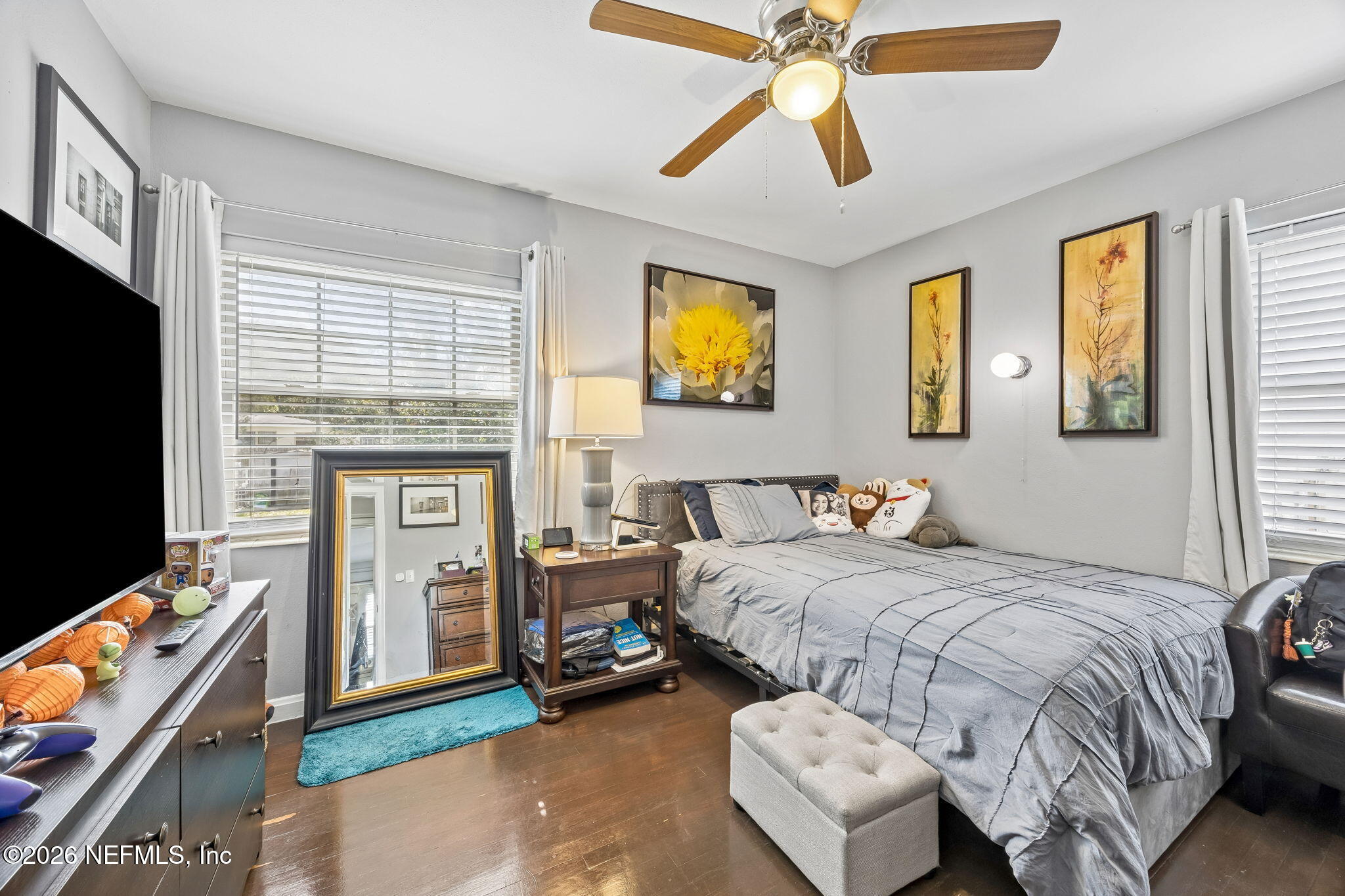 7022 Gaillardia Road South Jacksonville, FL 32211 - Photo 16 of 32 a bedroom with a bed and a flat screen tv