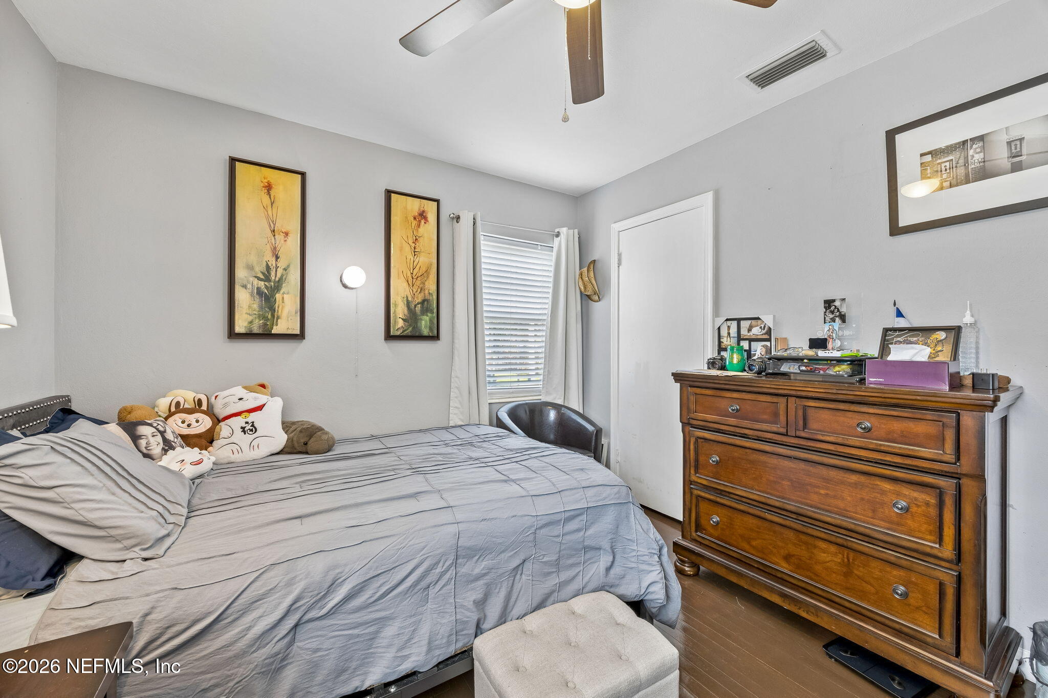 7022 Gaillardia Road South Jacksonville, FL 32211 - Photo 18 of 32 a bedroom with a bed and wooden floor