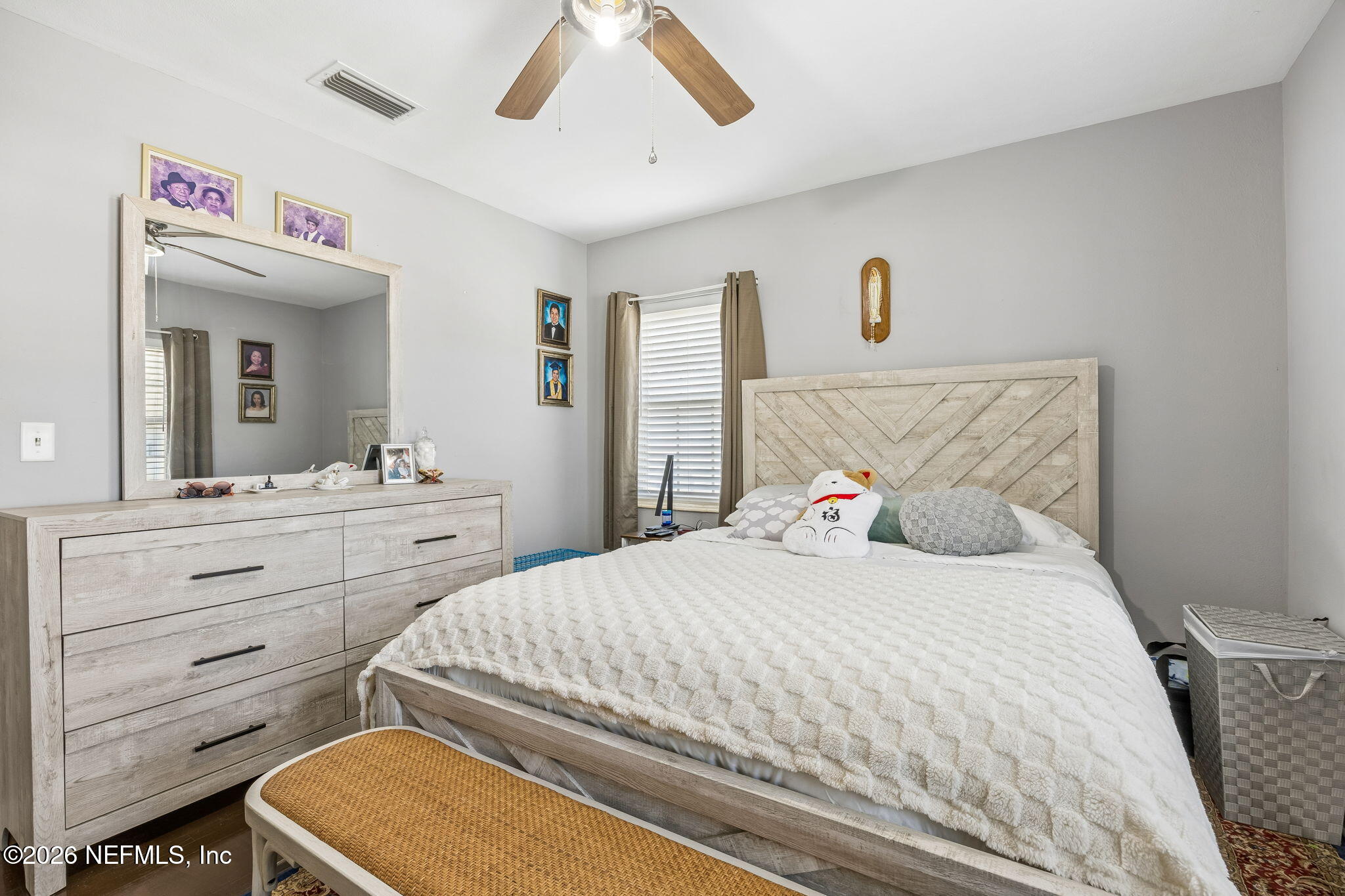 7022 Gaillardia Road South Jacksonville, FL 32211 - Photo 20 of 32 a bedroom with a bed and a dresser
