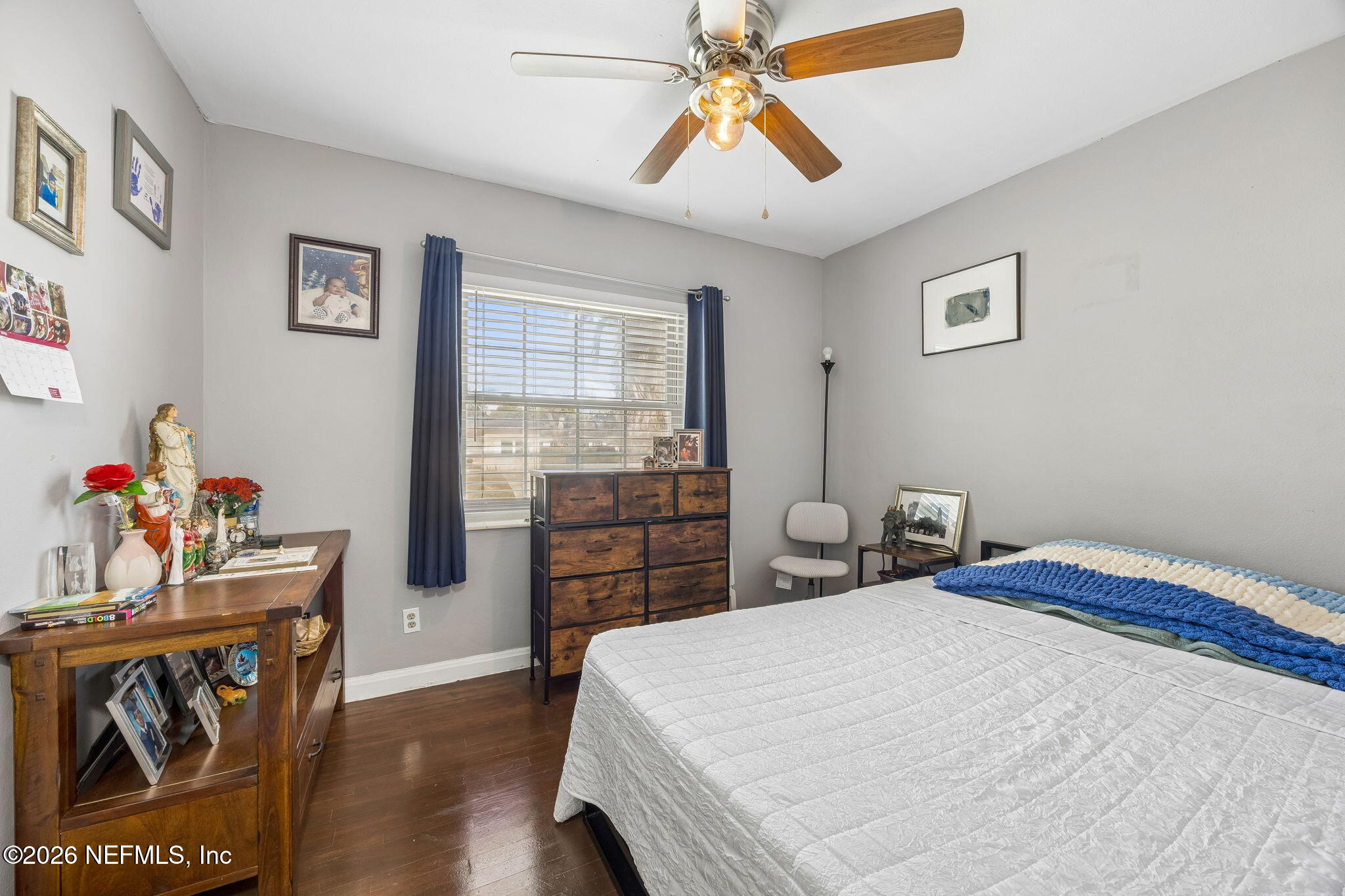7022 Gaillardia Road South Jacksonville, FL 32211 - Photo 21 of 32 a bedroom with a bed and wooden floor