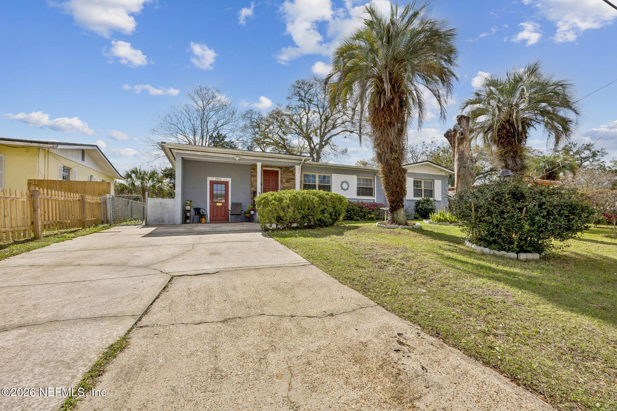 7022 Gaillardia Road South Jacksonville, FL 32211 - Photo 3 of 32 a house with palm tree in front of it