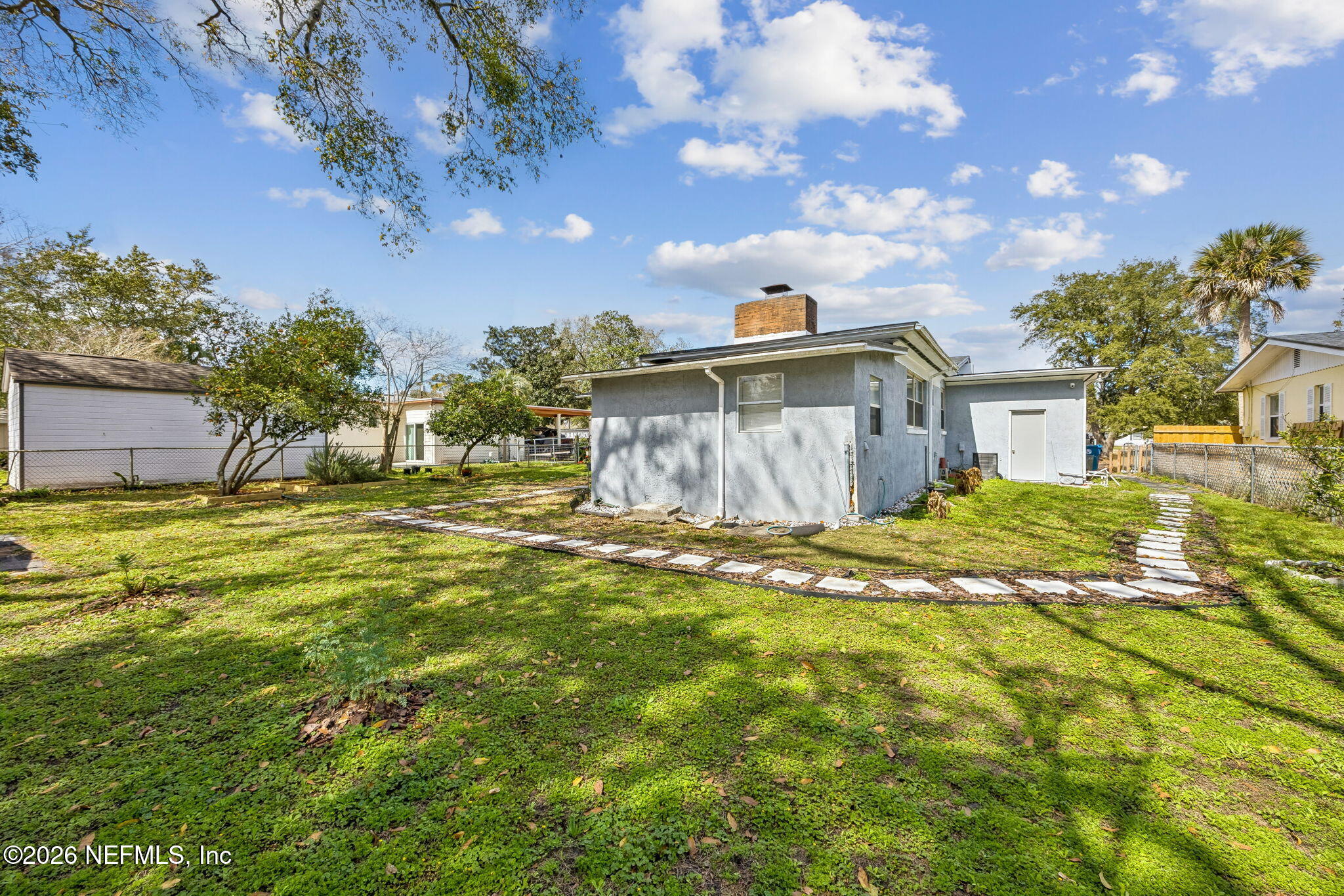 7022 Gaillardia Road South Jacksonville, FL 32211 - Photo 31 of 32 a view of a house with a yard
