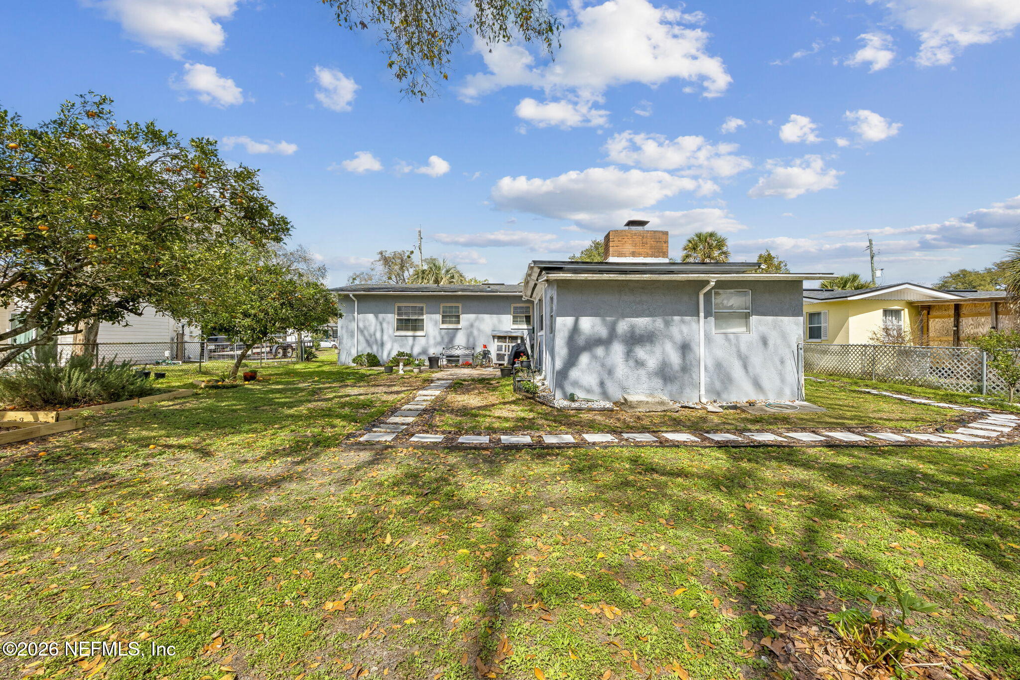 7022 Gaillardia Road South Jacksonville, FL 32211 - Photo 32 of 32 a view of a house with a yard