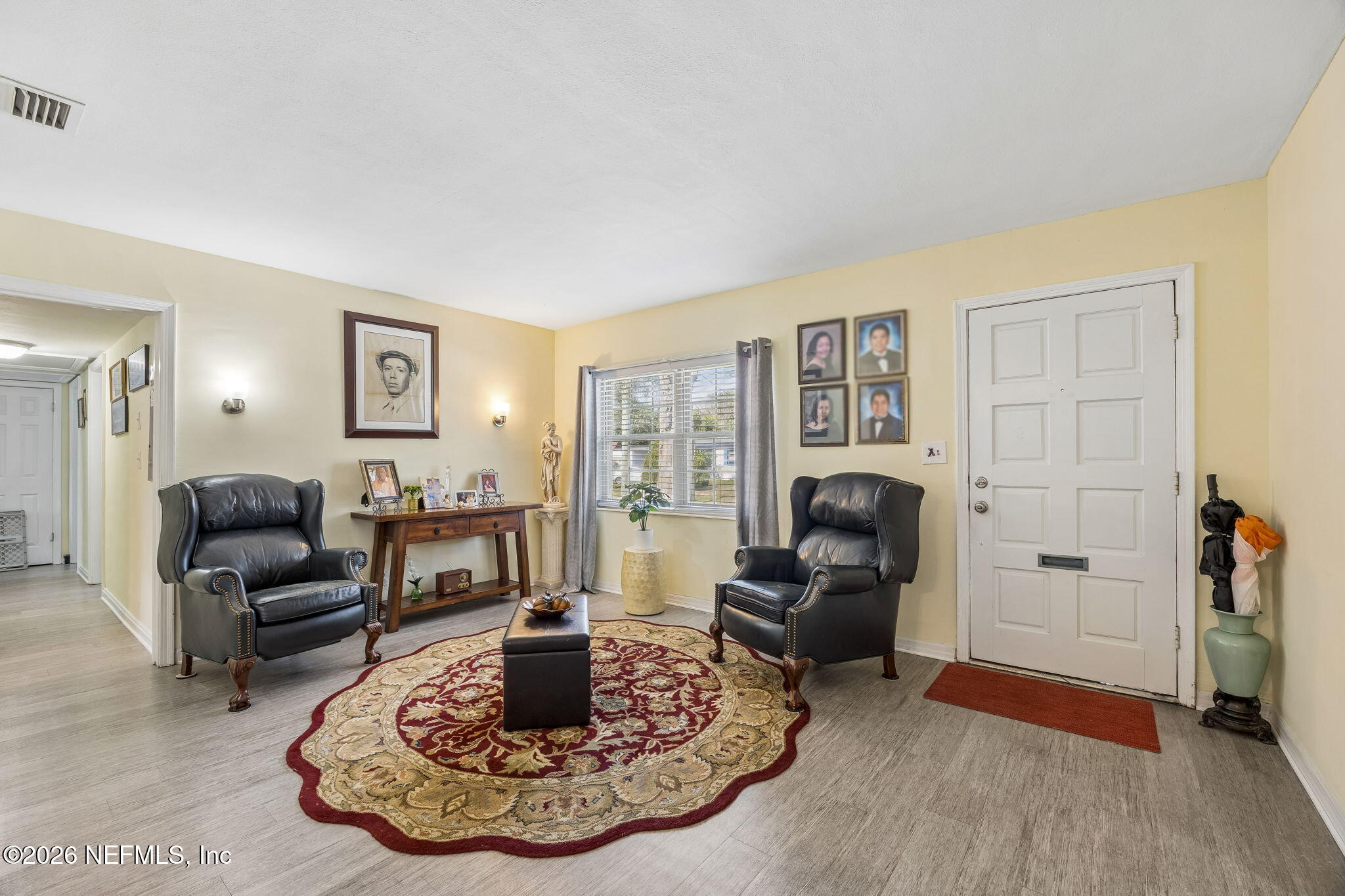 7022 Gaillardia Road South Jacksonville, FL 32211 - Photo 5 of 32 a living room with furniture and a fireplace