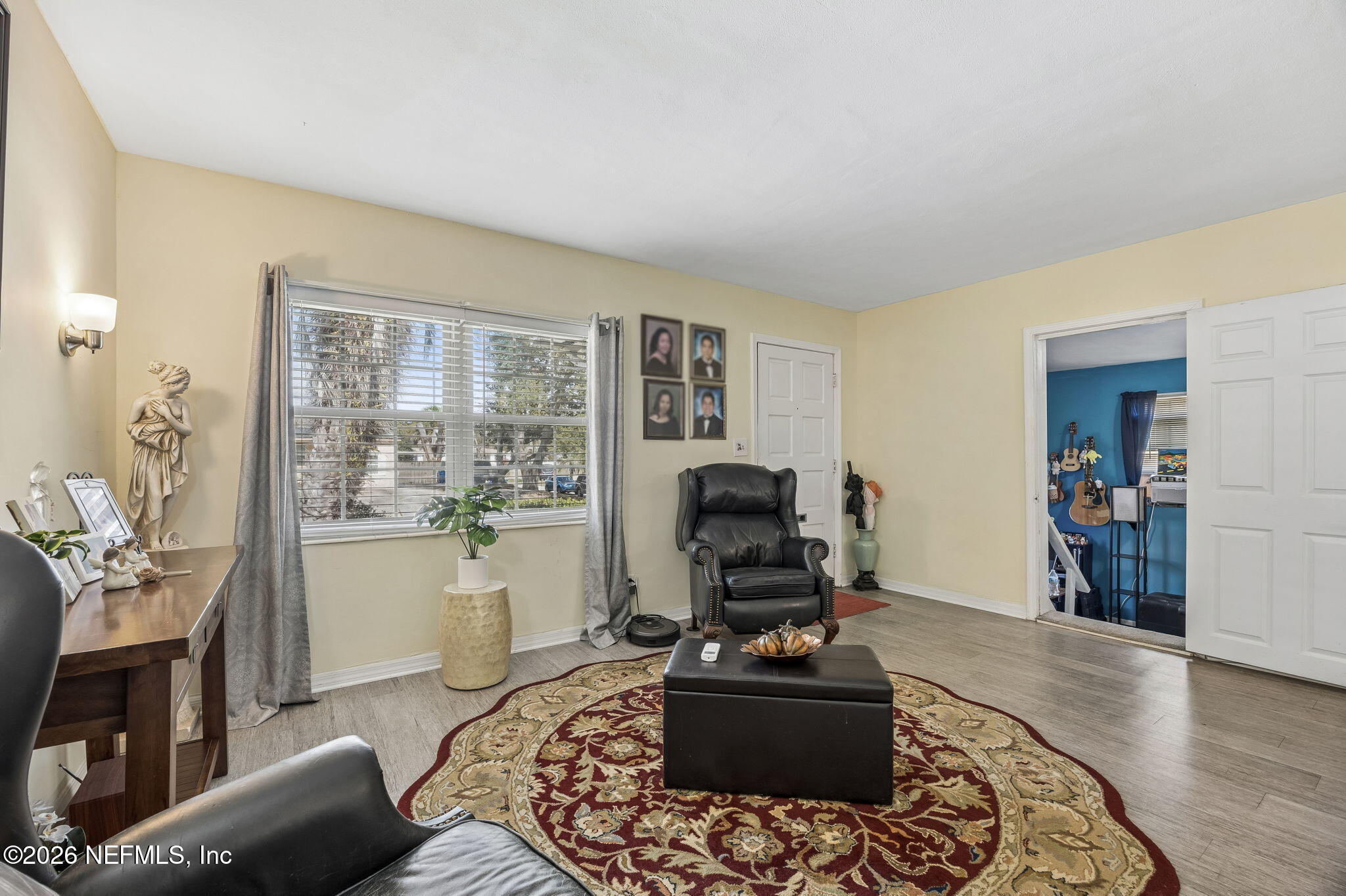 7022 Gaillardia Road South Jacksonville, FL 32211 - Photo 6 of 32 a living room with furniture and a fireplace