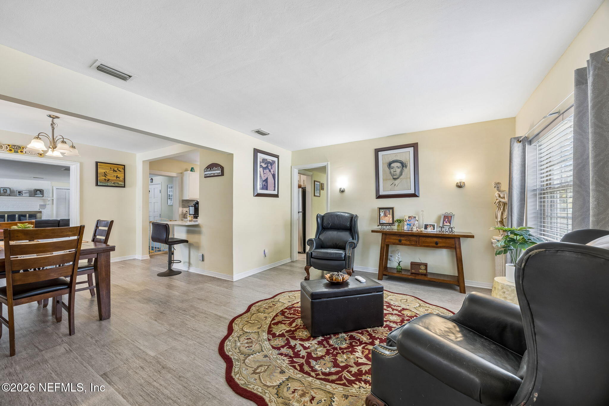 7022 Gaillardia Road South Jacksonville, FL 32211 - Photo 7 of 32 a living room with furniture or couch and a fireplace