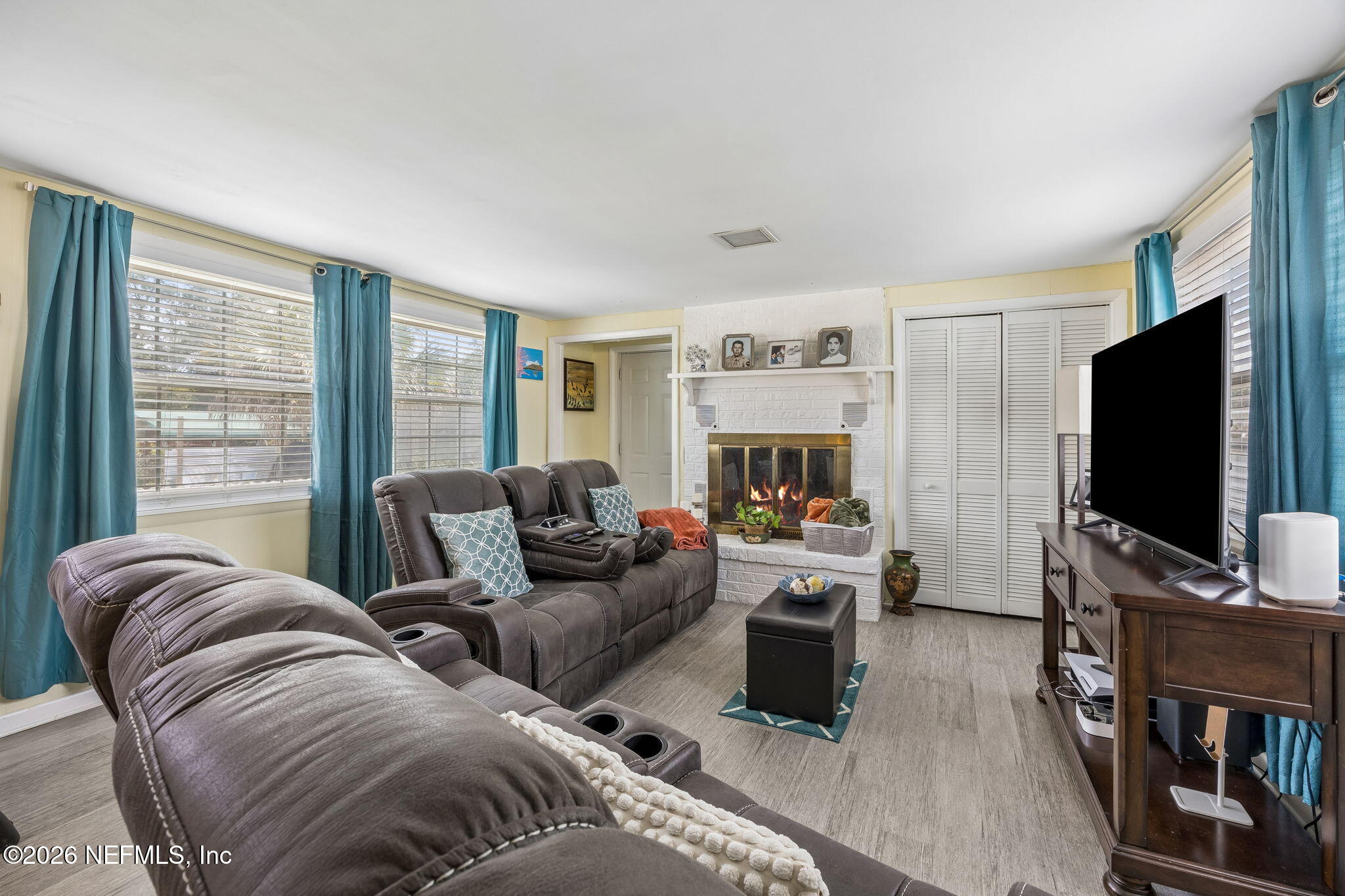 7022 Gaillardia Road South Jacksonville, FL 32211 - Photo 10 of 32 a living room with furniture and a flat screen tv