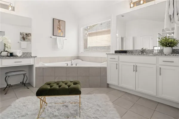 a bedroom with a bed and a table in it