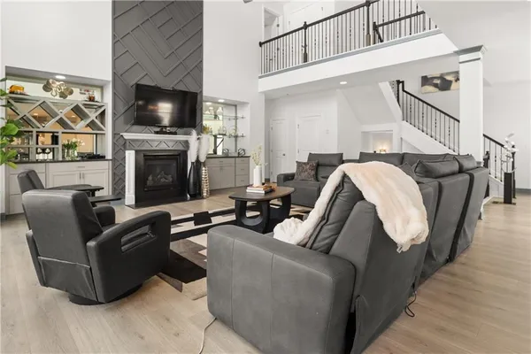 a kitchen with stainless steel appliances kitchen island granite countertop a stove a sink a refrigerator and a cabinets