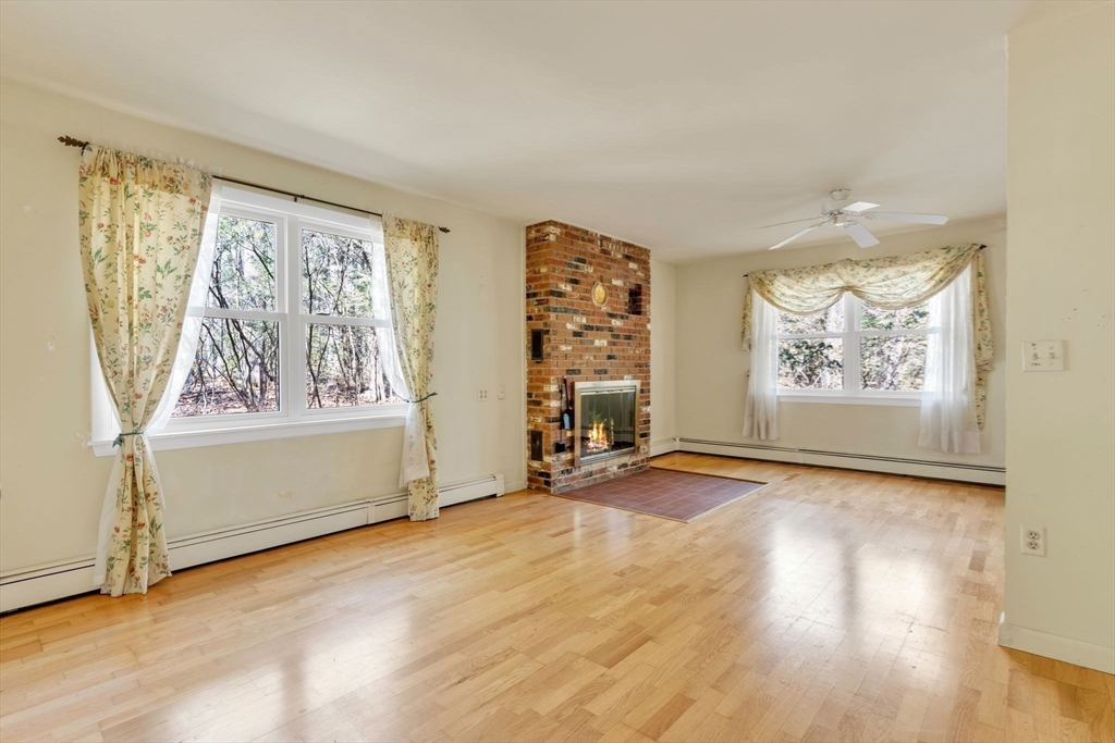 213 North Valley Road Pelham, MA 01002 - Photo 28 of 42 a view of an empty room with window and wooden floor