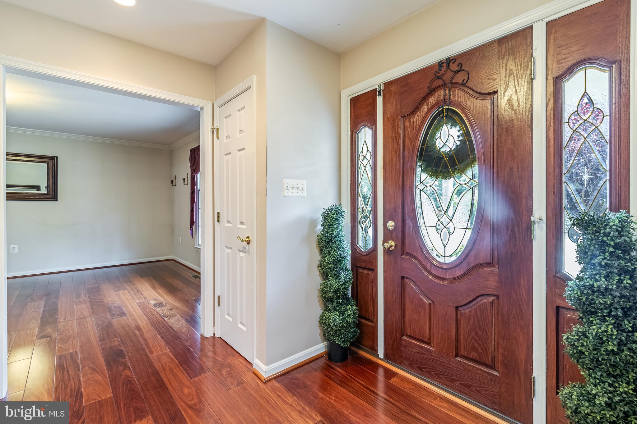 203 Morgans Ridge Court La Plata, MD 20646 - Photo 31 of 59 an entryway with wooden floor mirror and a mirror