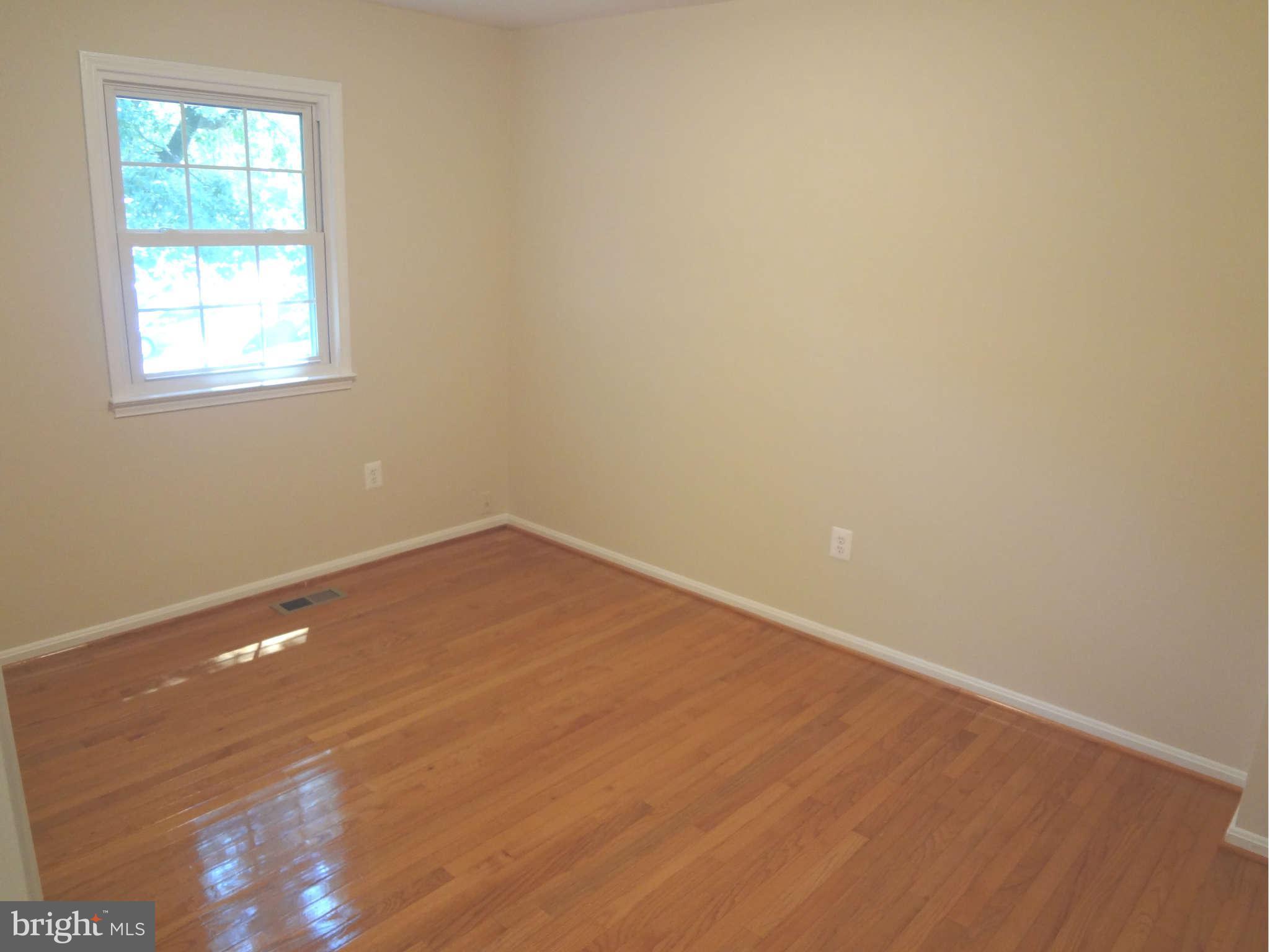 6354 Draco Street Burke, VA 22015 - Photo 15 of 21 an empty room with a window