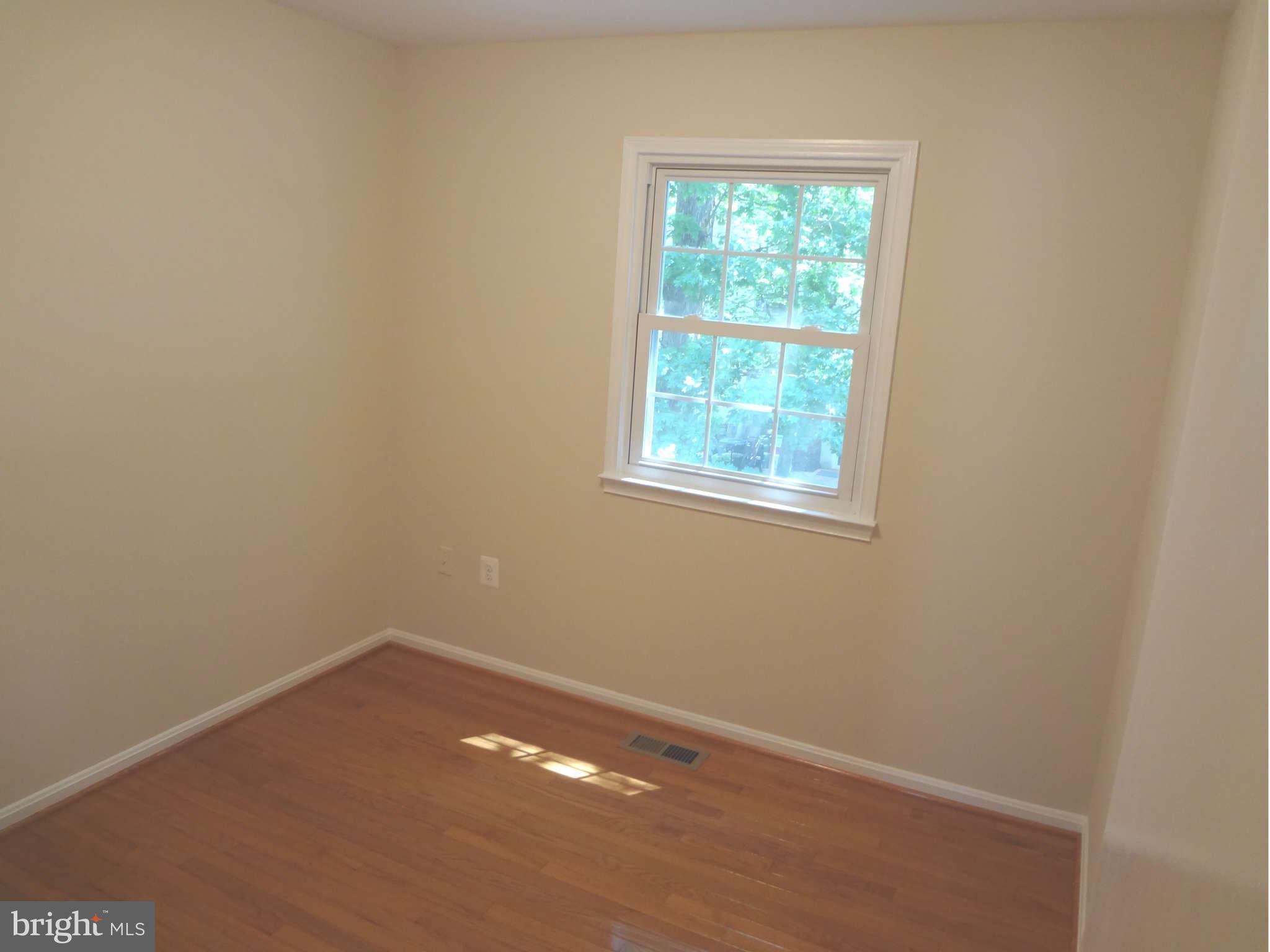 6354 Draco Street Burke, VA 22015 - Photo 16 of 21 an empty room with a window