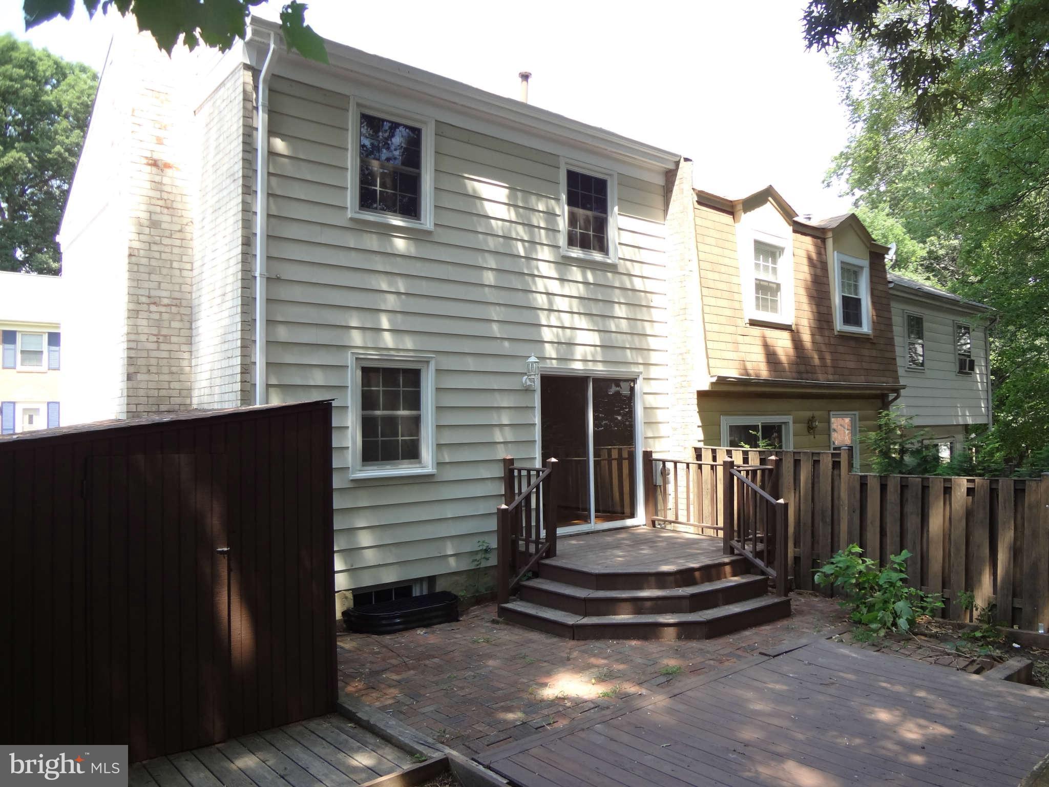 6354 Draco Street Burke, VA 22015 - Photo 21 of 21 a front view of house with a garden